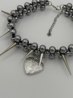 sharp medallion necklace