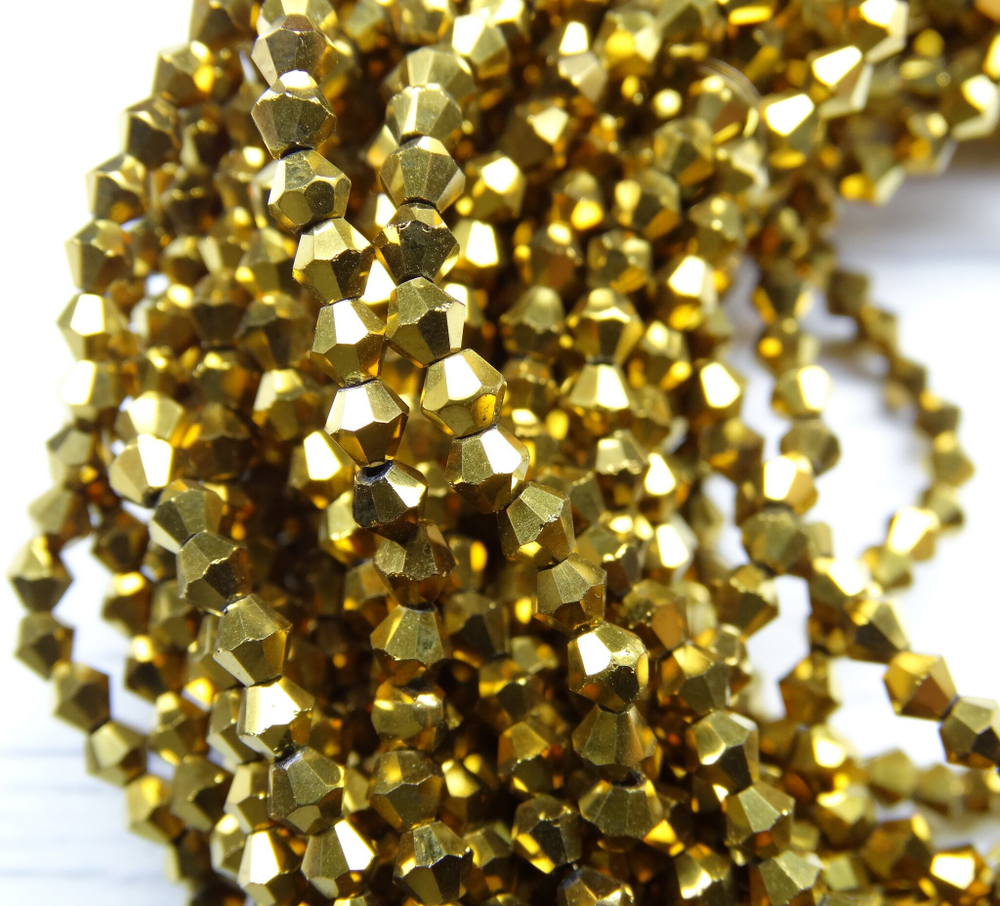 ББЛ002НН3 Хрустальные бусины "биконус", цвет: золото металлик, размер 3 мм, кол-во: 95-100 шт.