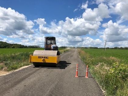 Асфальтировка второго участка подъездной дороги. Фото и видео