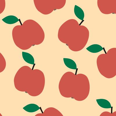 Простые красные яблоки на персиковом фоне