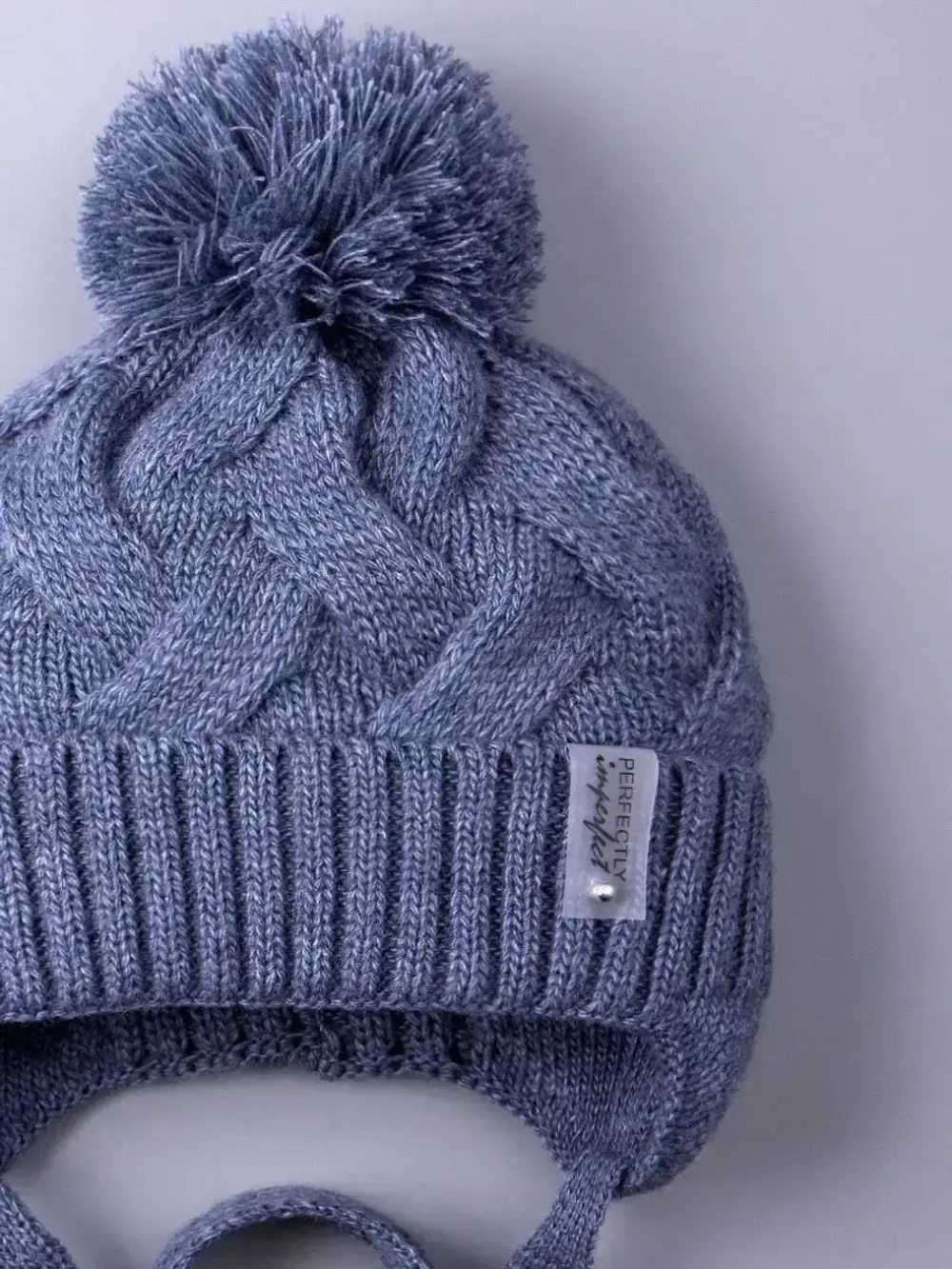 Шапка вязаная демисезонная на завязках для детей