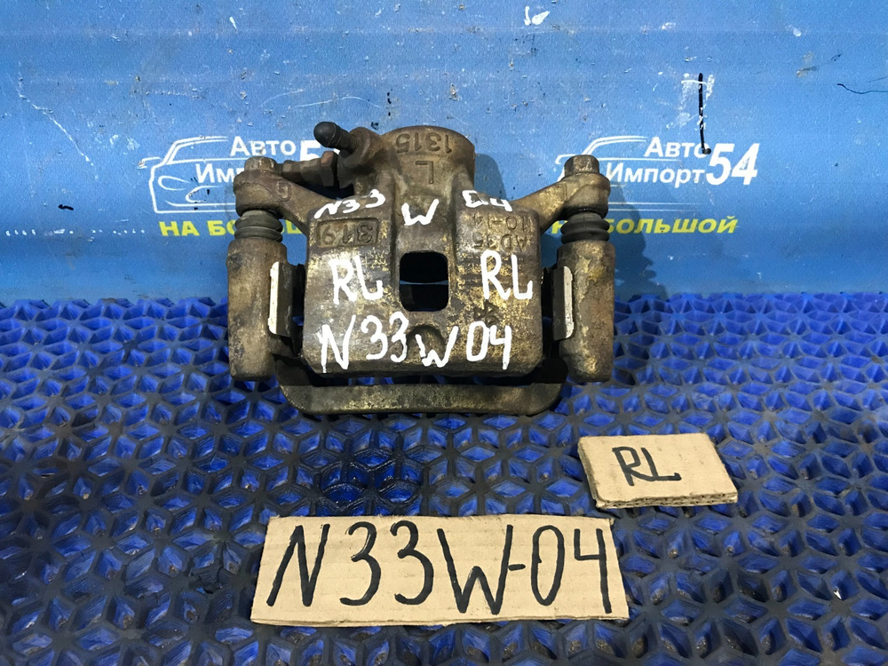 Суппорт тормозной задний левый MITSUBISHI CHARIOT 1994