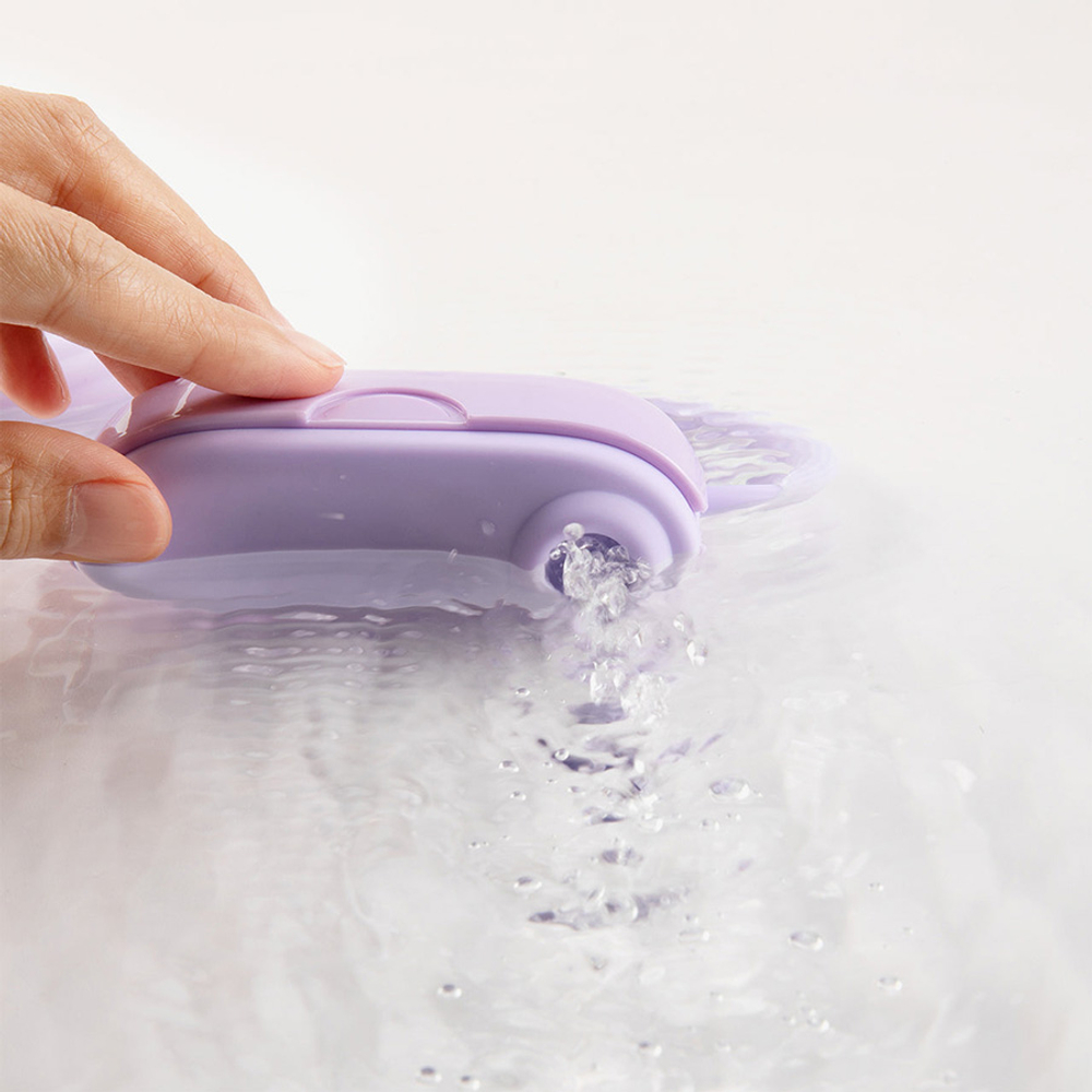 Фиолетовое силиконовое виброяйцо с вакуумным стимулятором в роскошной сумочки Otouch Louis Vibrator Dual Clitoral Suction & G-spot Vibrating Egg Purple