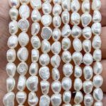 Жемчуг 2А речной бусины 5-6 мм, на нитке 38 см