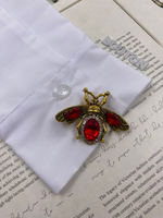 Накладка на пуговицу золотистая бронза "Жук" с красными стразами