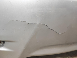 Бампер задний Toyota Corolla E180 5215902A20