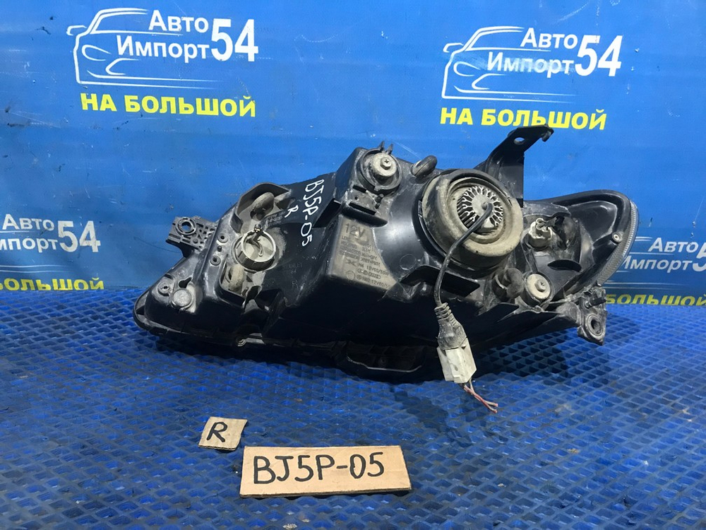 Фара передняя правая MAZDA FAMILIA 2000