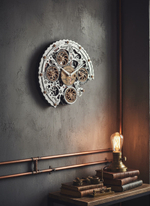 Часы WOODandROOT Automaton Bite 1682 в индустриальном интерьере — на серой стене рядом с медными трубами и настольной лампой в стиле лофт