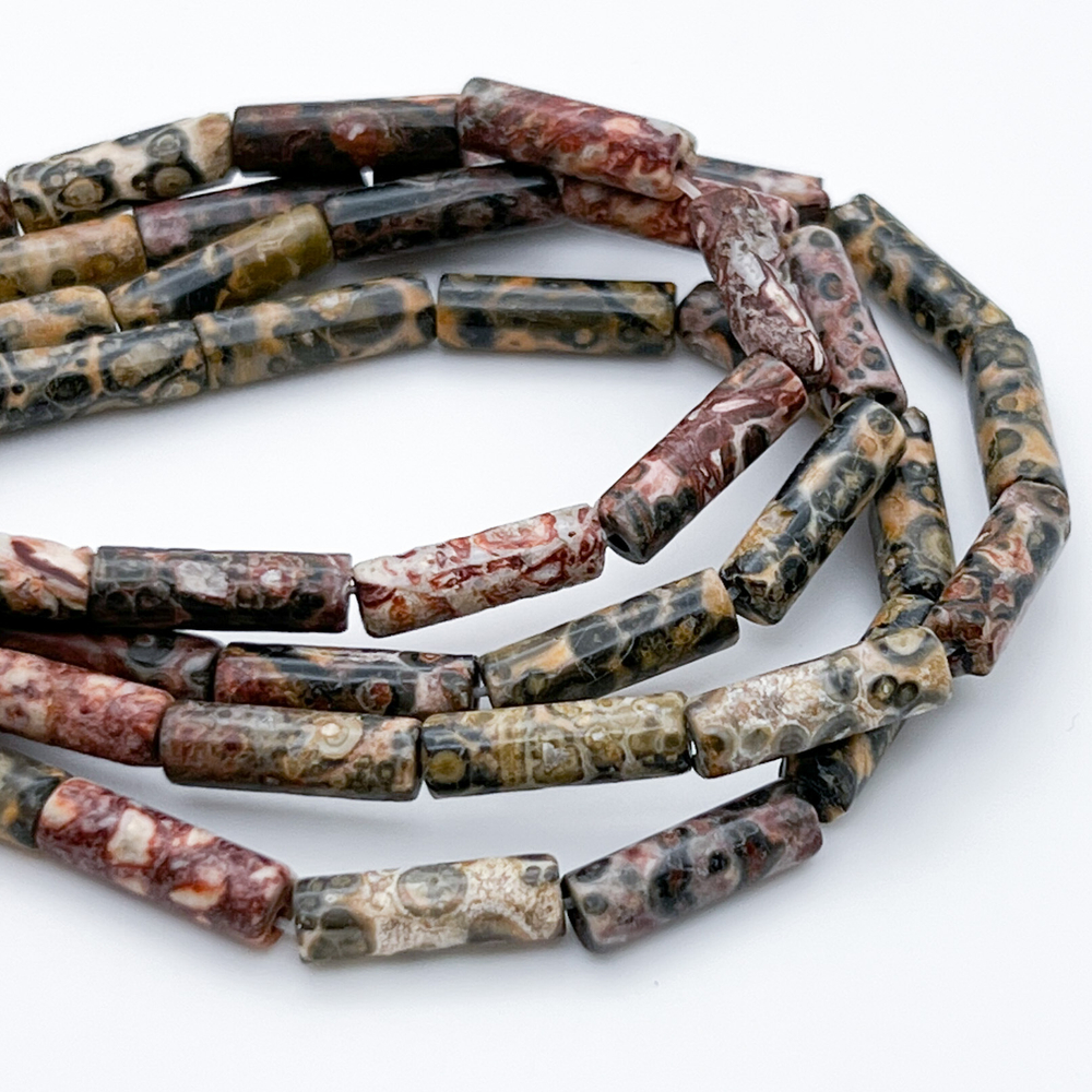 Риолит, размер около 14*4 мм, цена за 13-14 шт (1/2 нити)