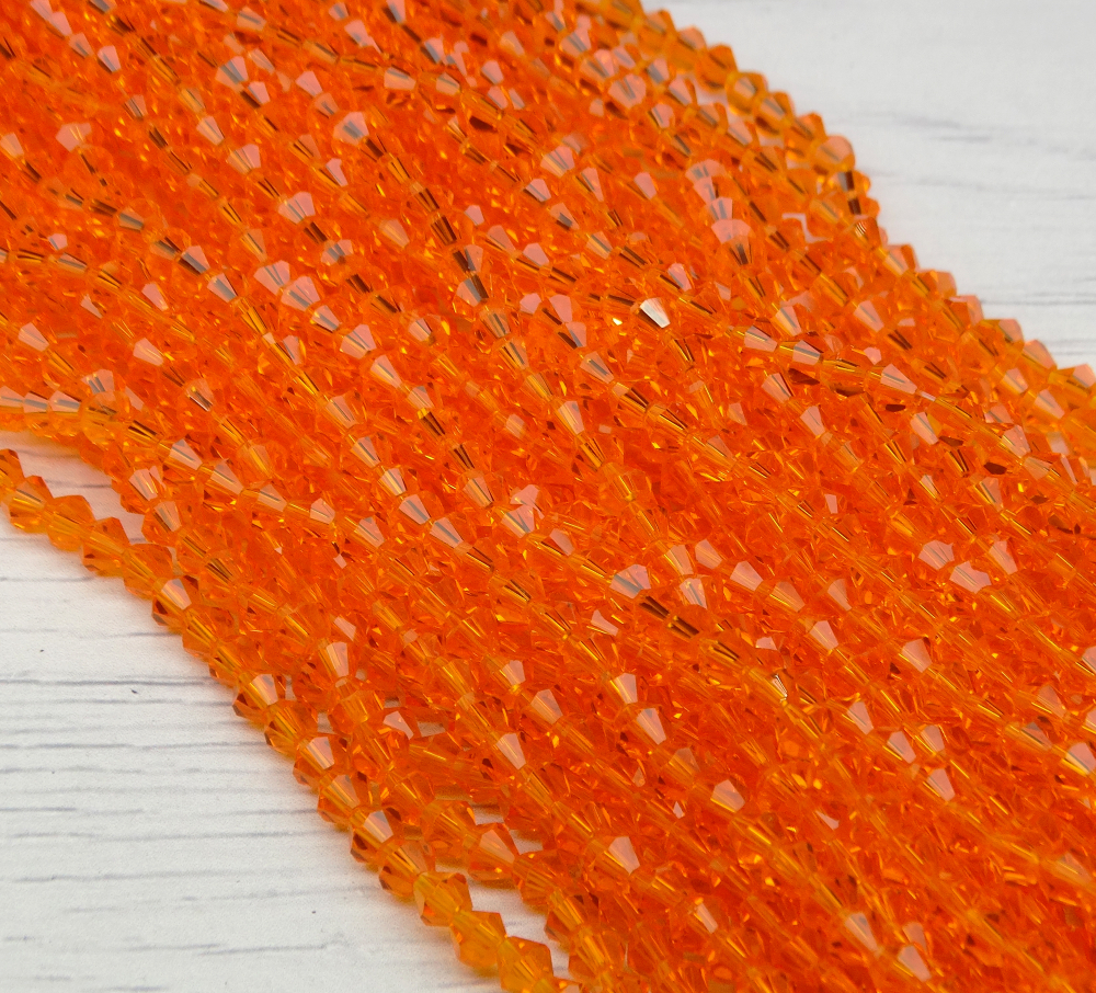 ББ007НН4 Хрустальные бусины "биконус", цвет: оранжевый прозрачный, размер 4 мм, кол-во: 95-100 шт.