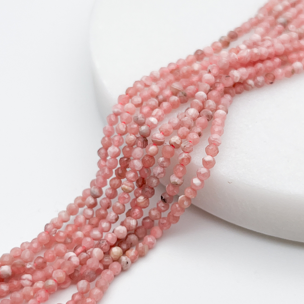 Родохрозит граненый бусины, диаметр 2,2-2,3 мм, цена за отрезок 19 см (1/2 нити)