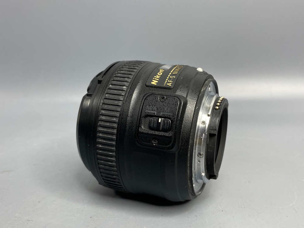 Nikon 50mm 1.8G пылинки