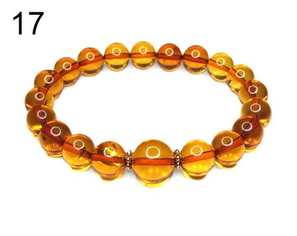 Браслет из цельного янтаря шар коньяк