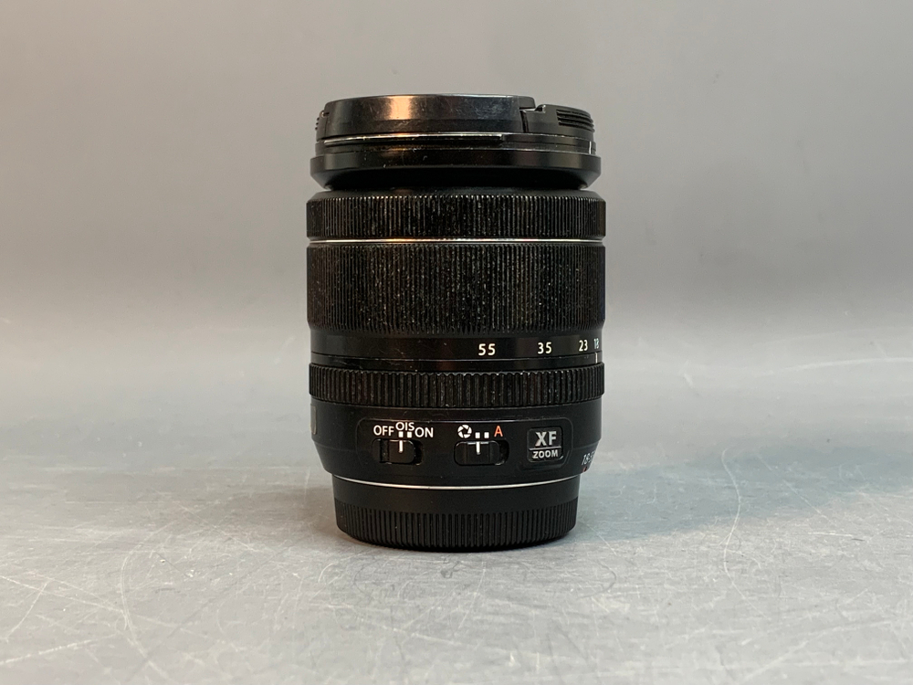 FujiFilm XF 18-55mm 2.8-4 R LM OIS, маленький точка на передней линзе