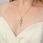 Подвеска «Колибри» из красного золота с топазами, натуральными топазами white и эмалью