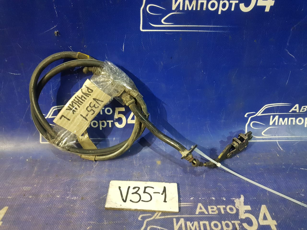 Трос ручника левый NISSAN SKYLINE 2004