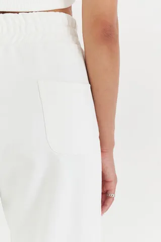 Свободные джоггеры без начеса из премиум футера кремового