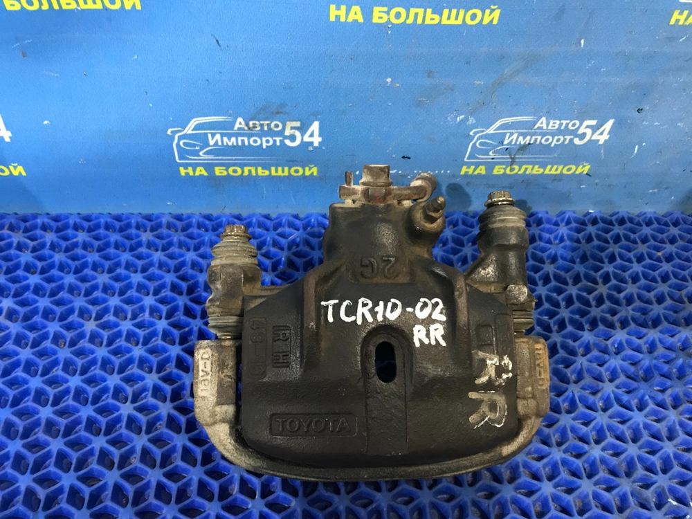 Суппорт тормозной задний правый TOYOTA ESTIMA 1999