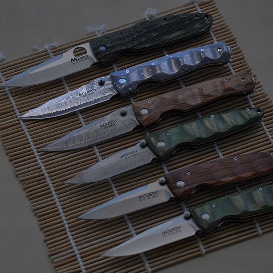 Складной нож Mcusta Damascus Elit Tactility MC-0123D c клинком из стали VG-10 San Mai (Laminated Stainlesss Damascus) рукоять Corian