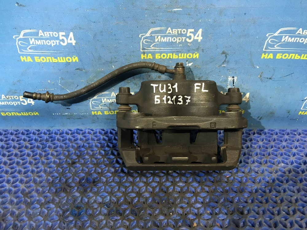 Суппорт тормозной передний левый NISSAN PRESAGE 2003-2009