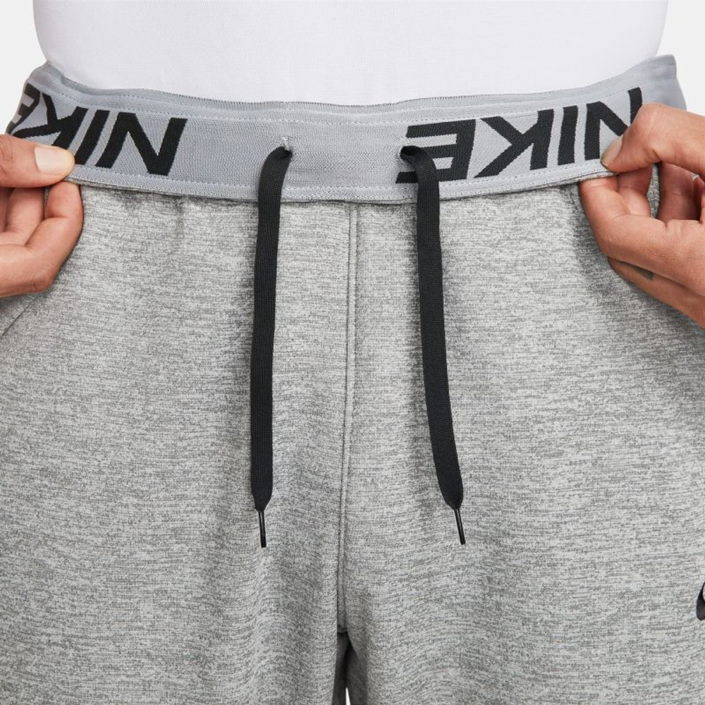 Теннисные брюки Nike Therma-FIT Tapered Fitness Pants - dark grey heather/particle grey/black - Gray