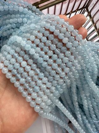 Нить бусин из тонированного кварца 6,5мм, гладкие