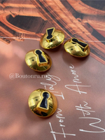 Пуговицы Скиапар. объемные "Скважина" золотистые с черной эмалью