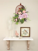 Композиция настенная с цветами в металлической клетке