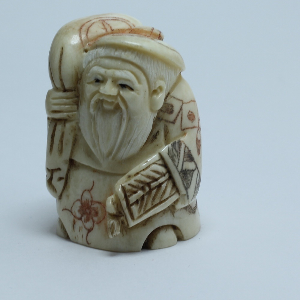 Нэцкэ Дзюродзин с мешком риса и веером