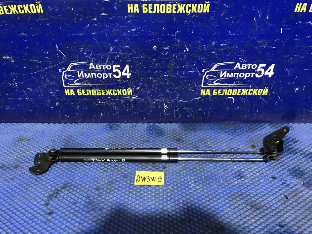 Амортизатор задней двери левый MAZDA DEMIO 2000