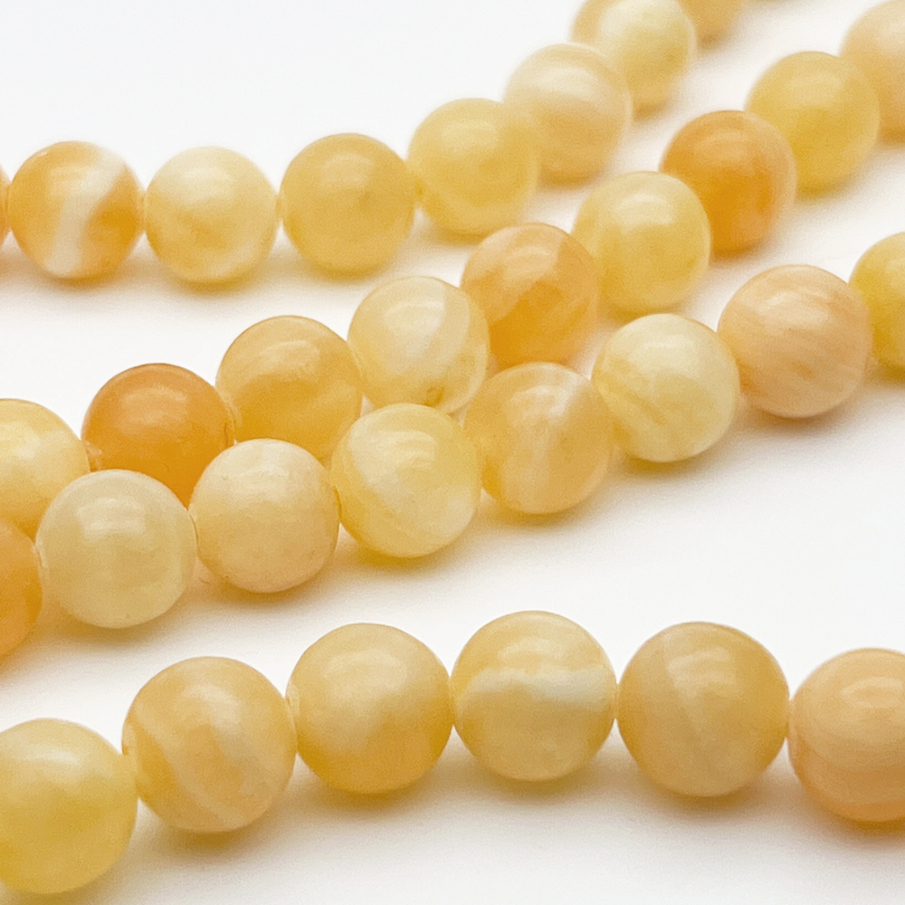 Кальцит желтый бусины, диаметр около 8,2-8,4 мм, цена за 22-23 шт (1/2 нити)