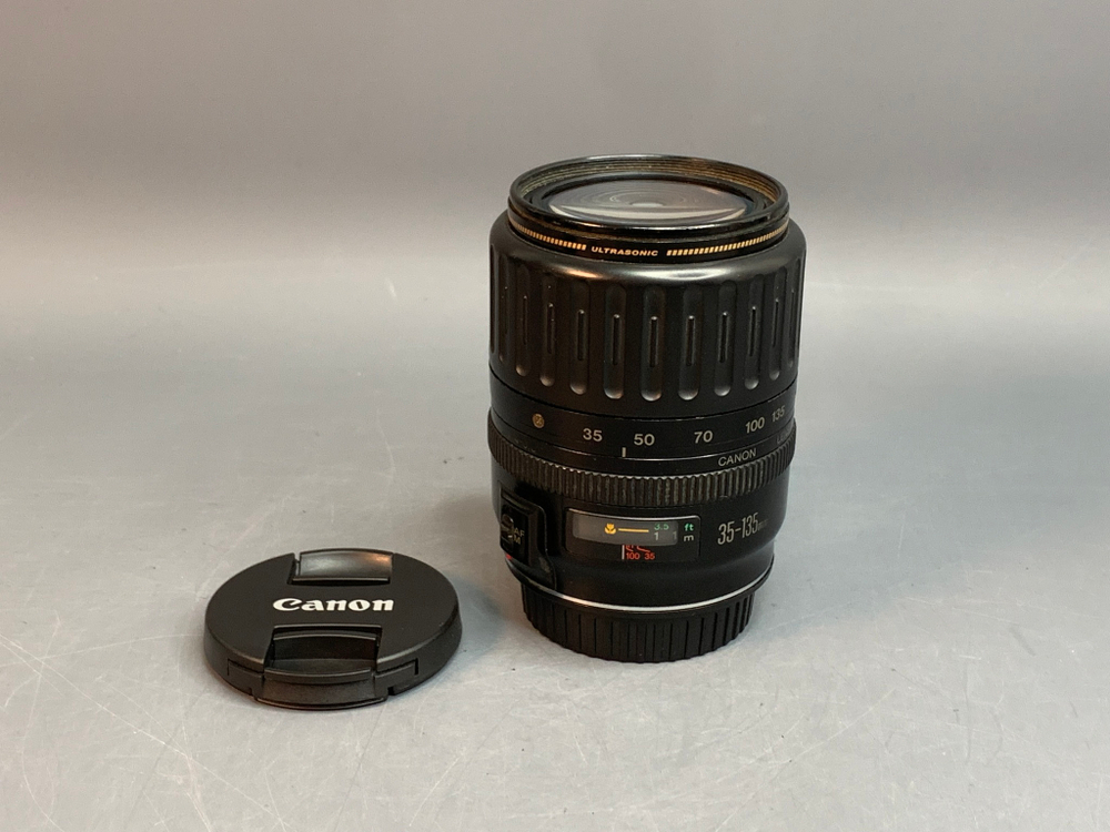 Canon EF 28-135mm 3.5-5.6 IS плохо работает кольцо зума, микроцарапины, внутри пыль