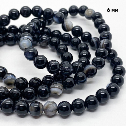 Агат черный бусины, тонированный, диаметр 6,1-6,3 мм, цена за 28-29 шт (1/2 нити)