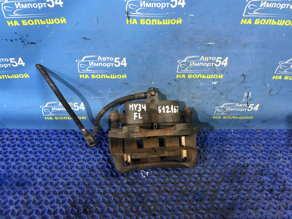 Суппорт тормозной передний левый NISSAN CEDRIC 1999-2004