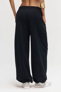 Широкие джоггеры без начеса с утяжкой черного цвета