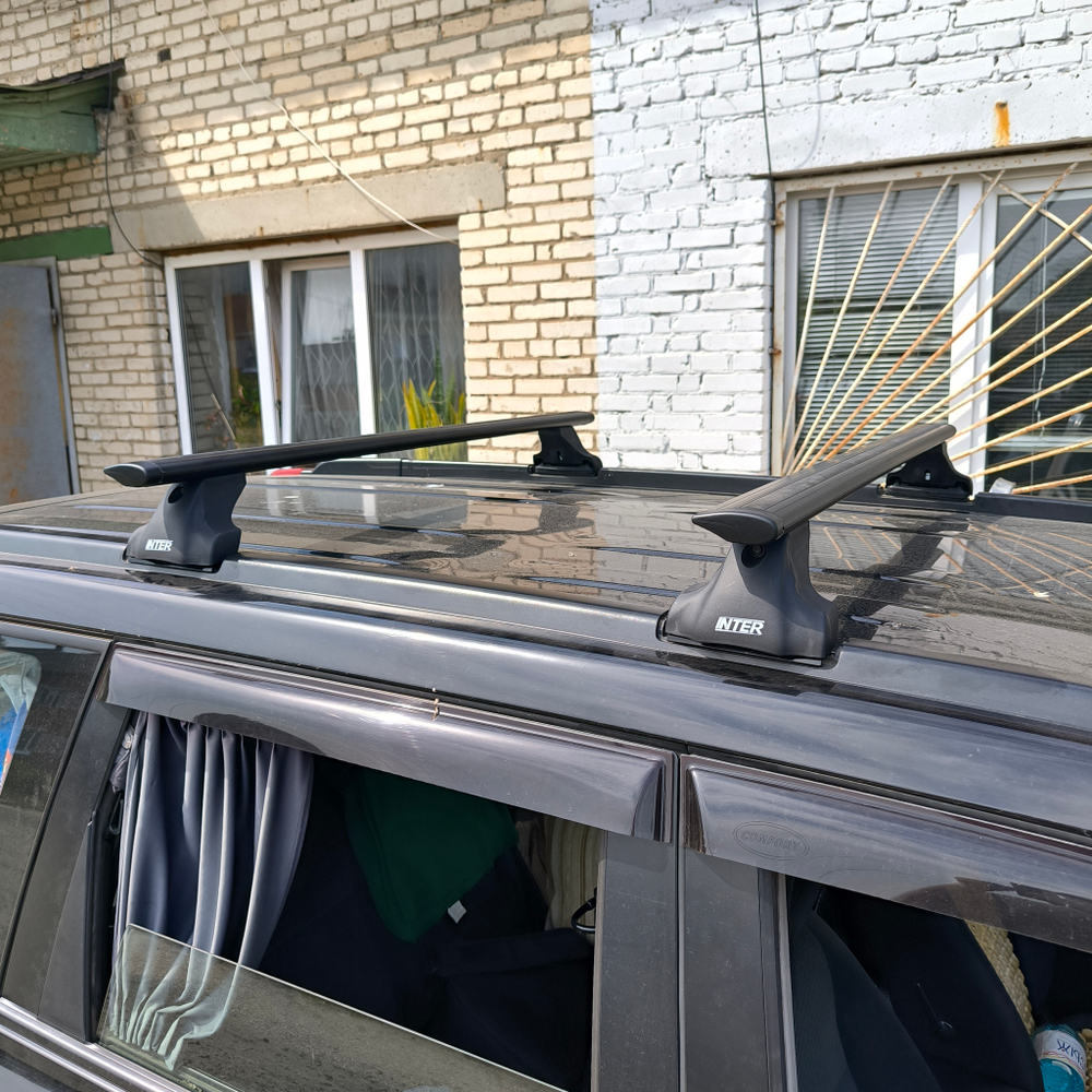 Багажник Интер Спектр на крышу Nissan X-Trail T30, T31 (Без фонарей) в штатные места чёрнве крыловидные дуги 120 см.