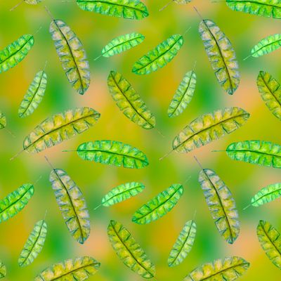 Palm leaves on abstract natural background seamless pattern