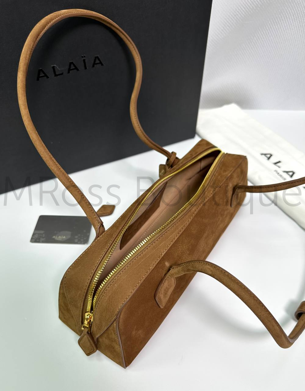 Женская сумка Alaia Le Teckel Medium коричневого цвета