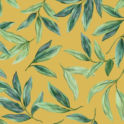 Зеленые листья на желтом фоне