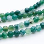 Агат тонированный зеленый, диаметр 6,2-6,3 мм, цена за 29-30 шт (1/2 нити)