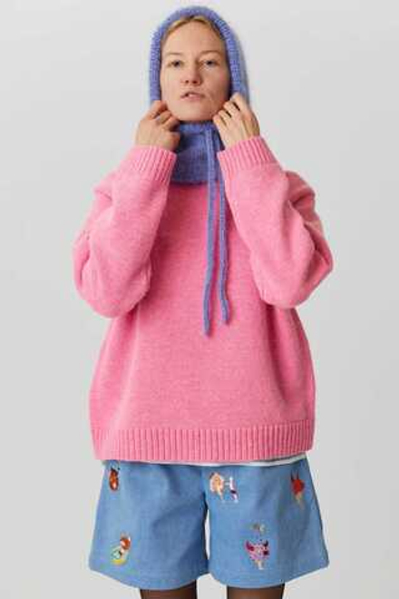 Свитер из шерсти розового цвета