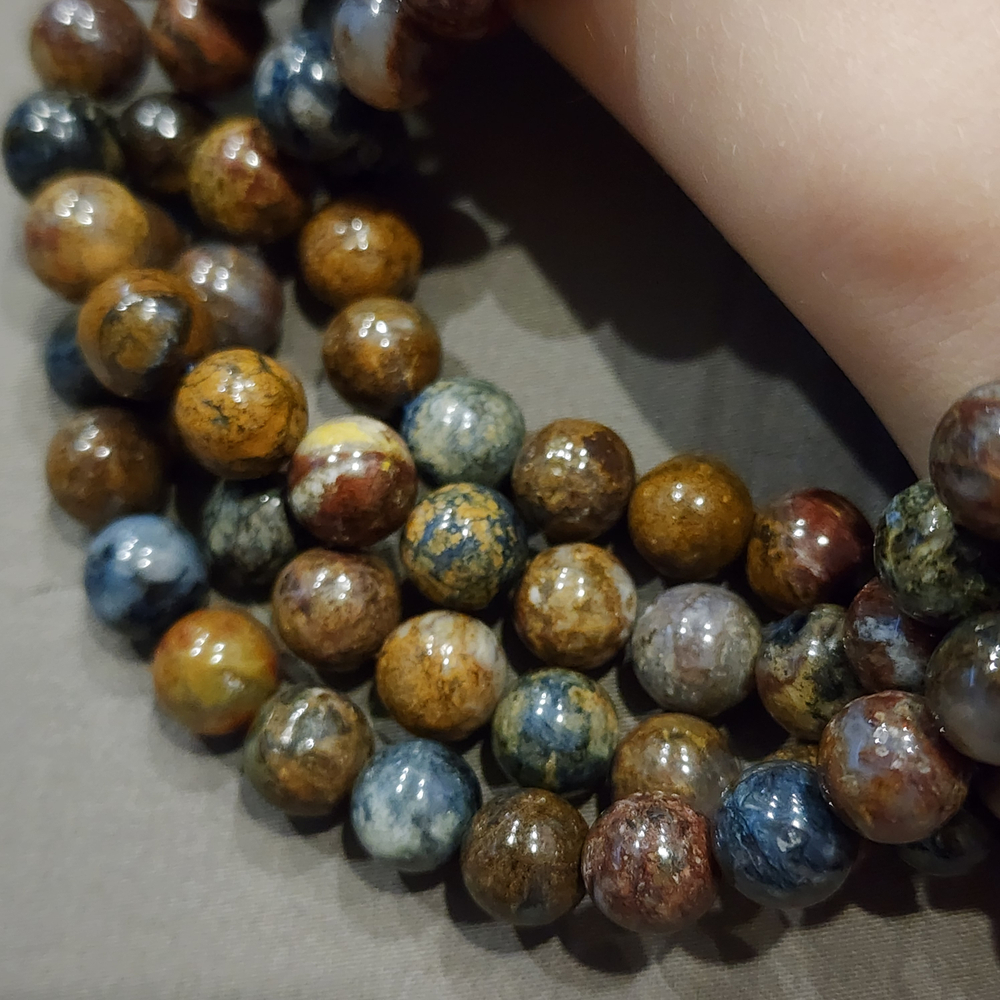 Питерсит, пестрый, гладкий шар 8 - 8.2мм, цена за нить 9.5см (1/4)