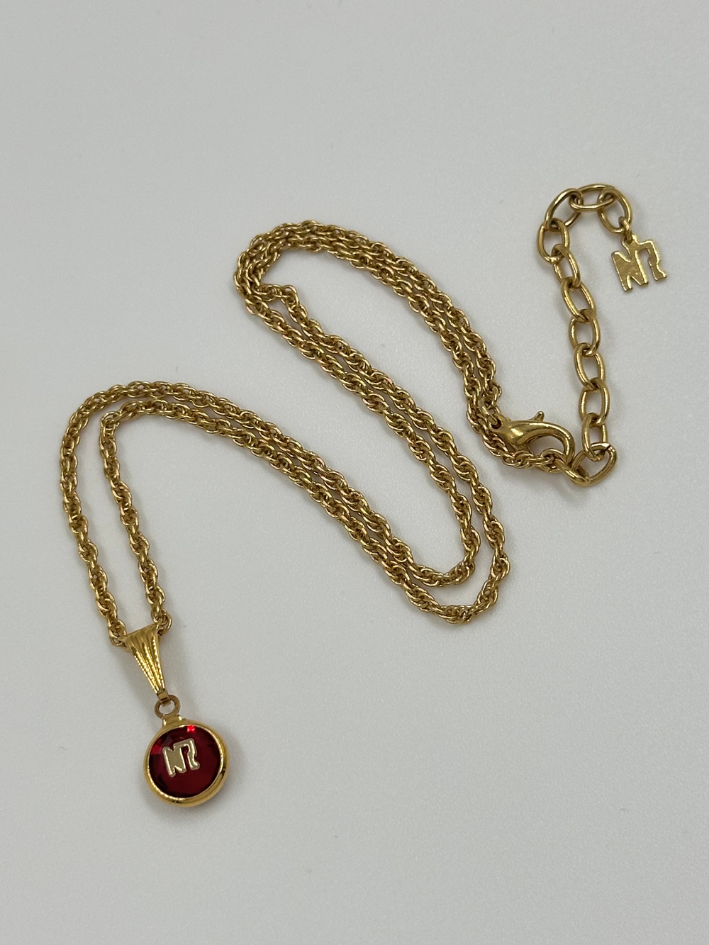 Миниатюрный кулон Nina Ricci