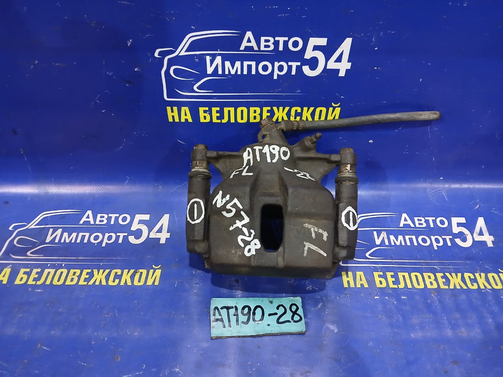 Суппорт тормозной передний левый TOYOTA CARINA E 1992