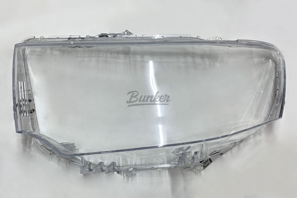 Стекло фары ЛЕВОЕ для Mitsubishi Pajero Sport 2 2008-2015/L200 2006-2015
