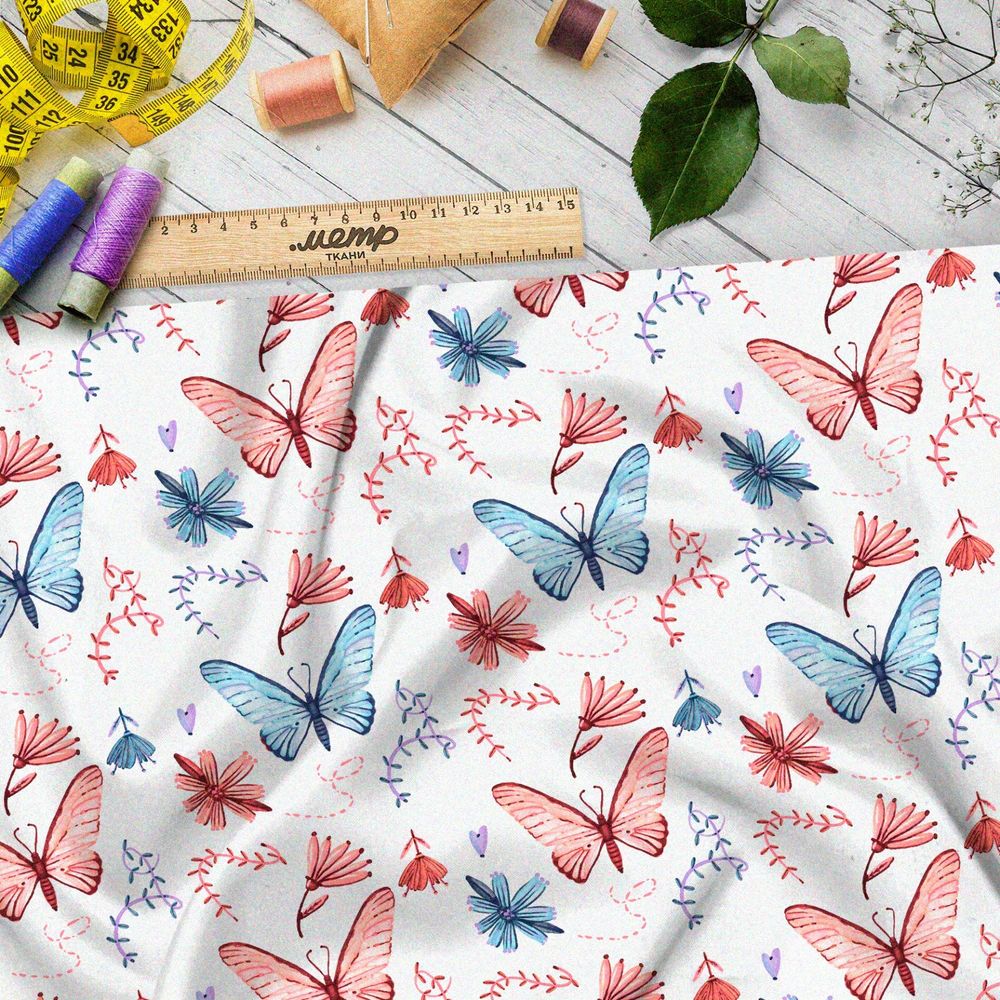 Ткань кулирная гладь голубые и розовые бабочки на белом фоне