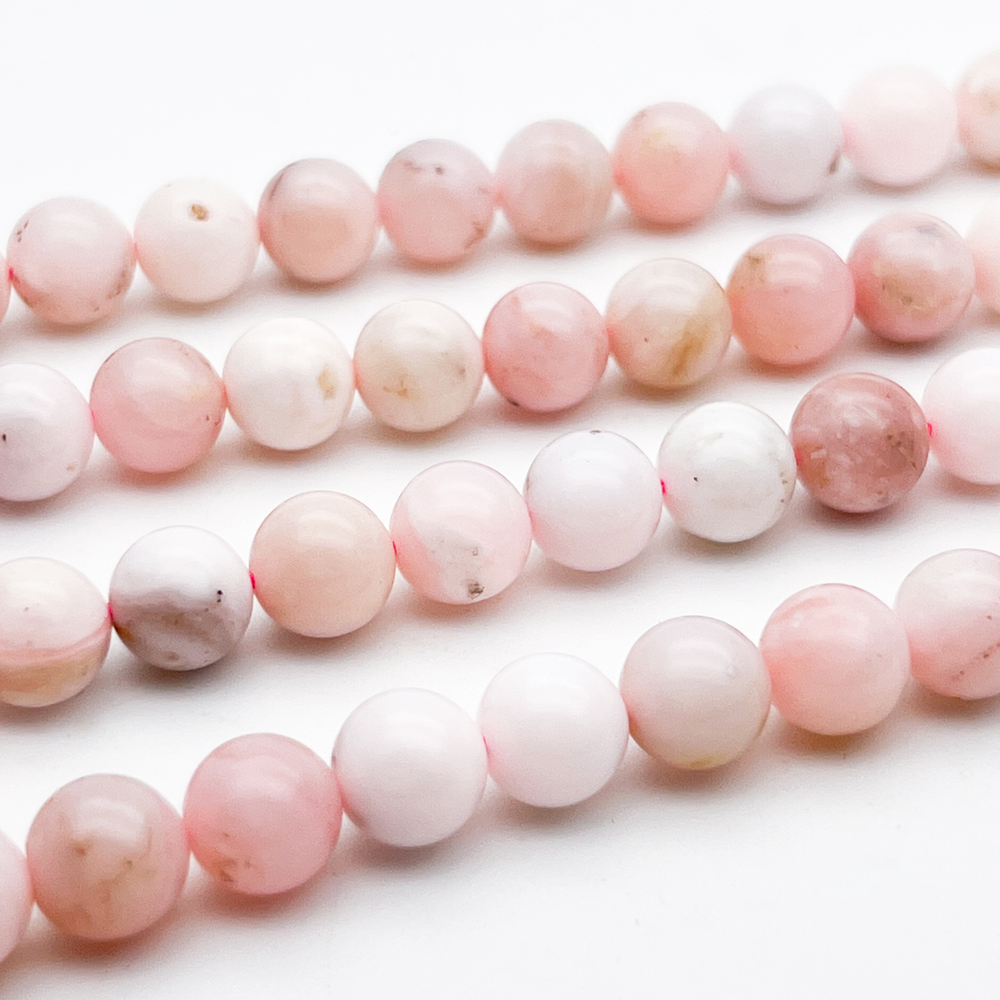 Опал розовый бусины, диаметр около 8,3-8,5 мм, цена за 11 шт (1/4 нити)