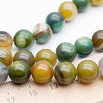 Агат тонированный бусины, цвет оливковый, диаметр около 10,2-10,4 мм, цена за 18-19 шт (1/2 нити)