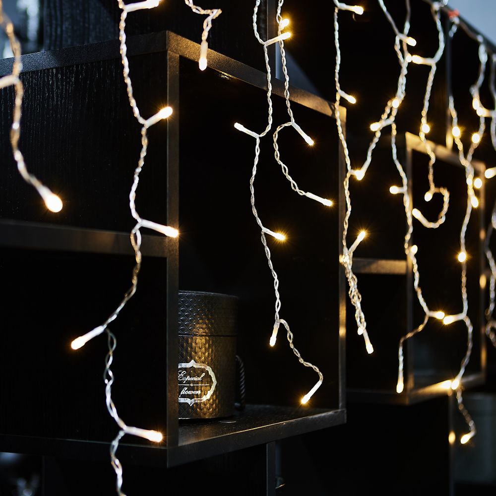 ULD-B6007-200-STK WARM WHITE IP44 Бахрома светодиодная со статическим свечением. 6м. Соединяемая. 200 светодиодов. Теплый белый свет. Провод прозрачный. ТМ Uniel