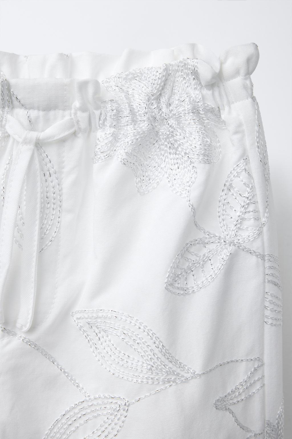 Shiny embroidered trousers